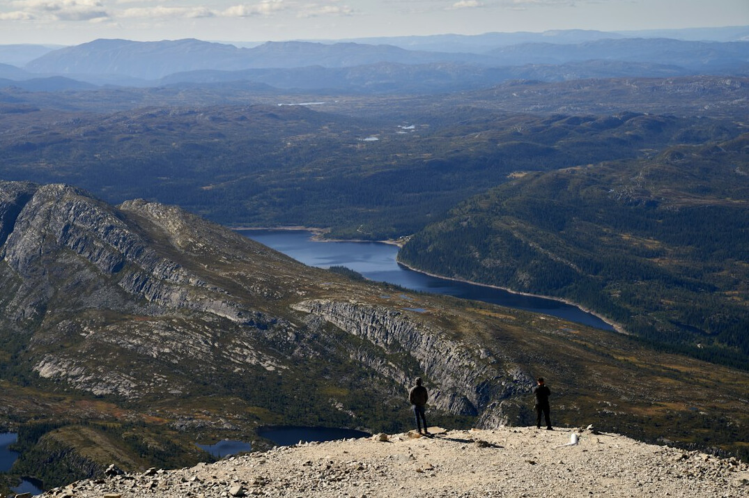 person standing on mountain top