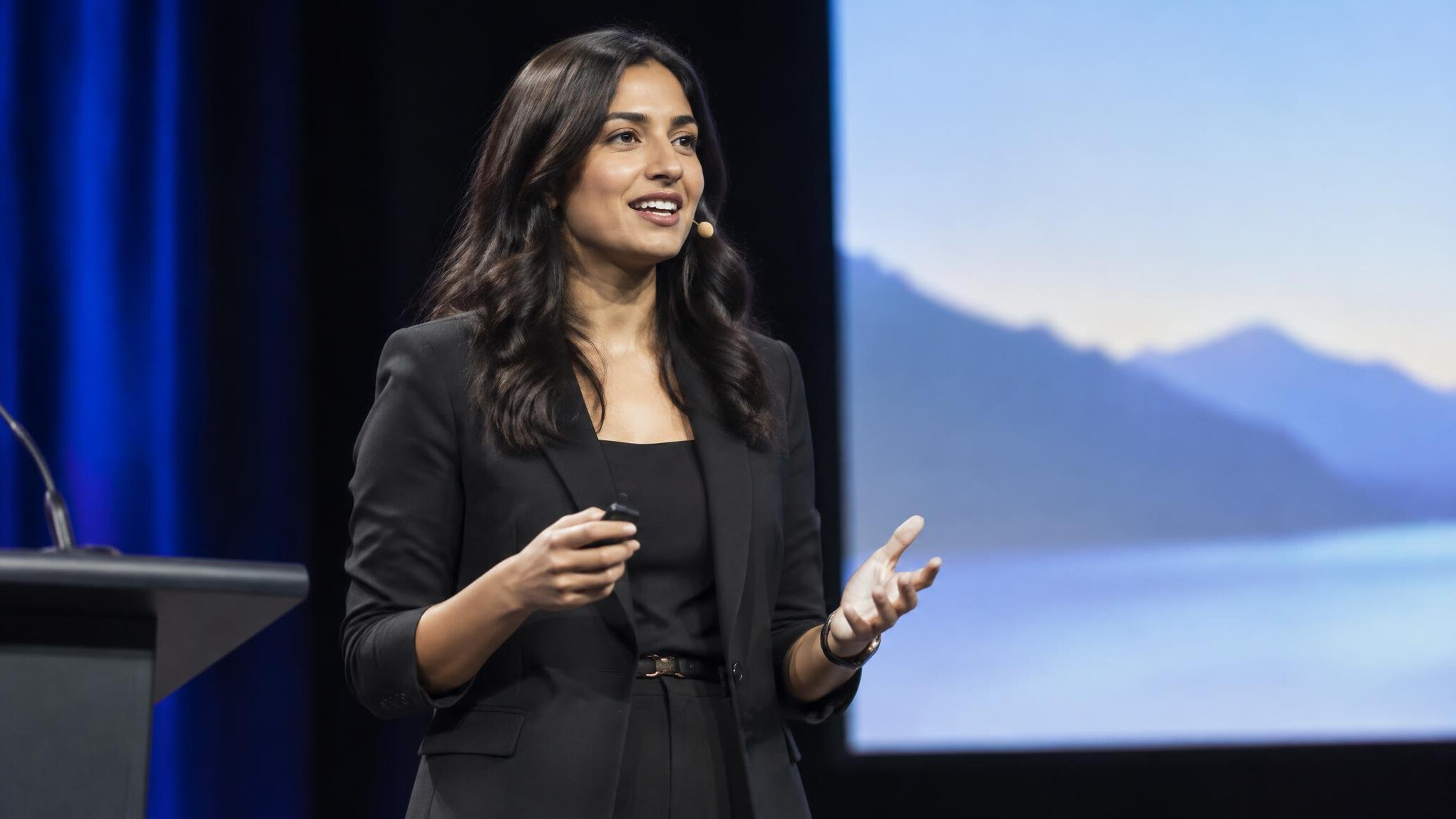 woman speaking confidently on stage